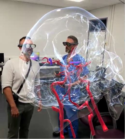 Patient and neurosurgeon viewing the 3D model